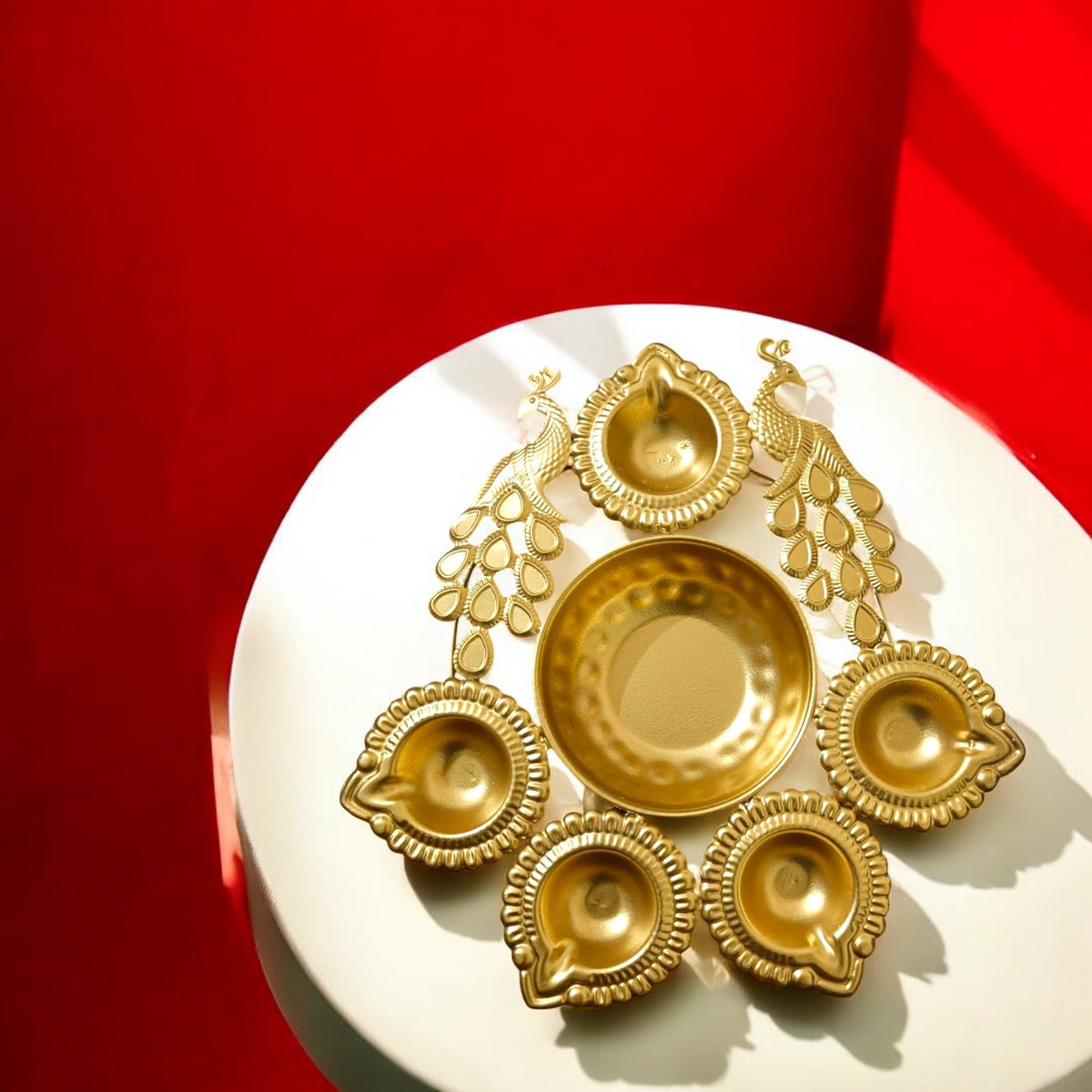 Gold Metal Decorative Diya Thali Set with 5 tealight holders and a center plate with a peacock design for home decor